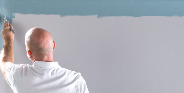 Man painting a wall